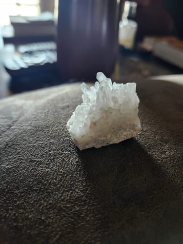 Customer's VIP Crystal Club cluster sitting on a soft surface, showing a white crystalline shape.