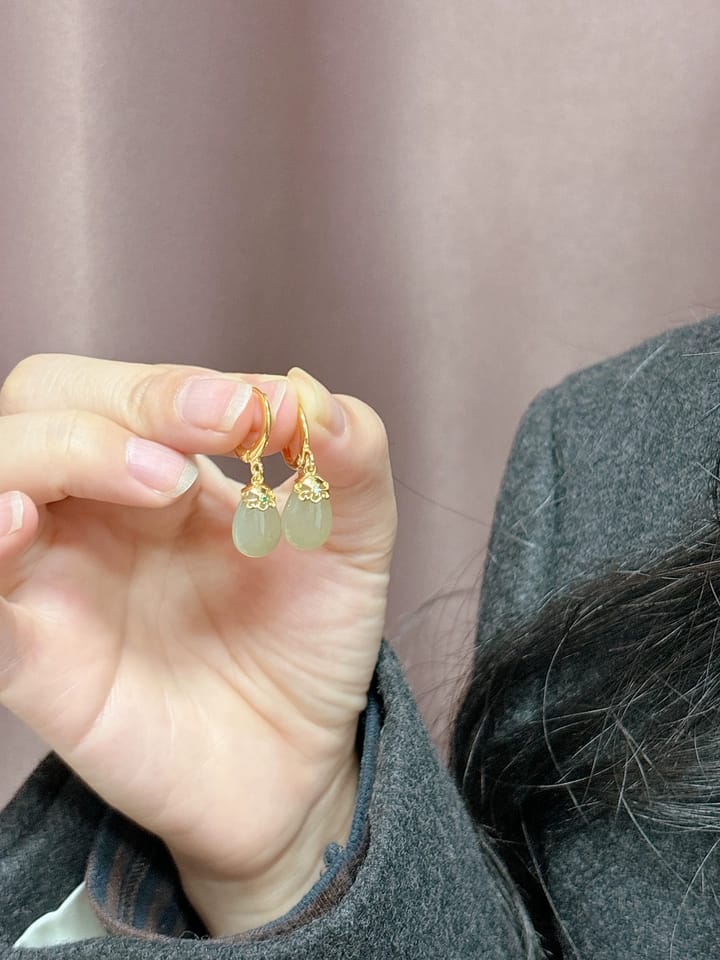 Customer photo review of Seraphine Jade Teardrop Huggie Earrings