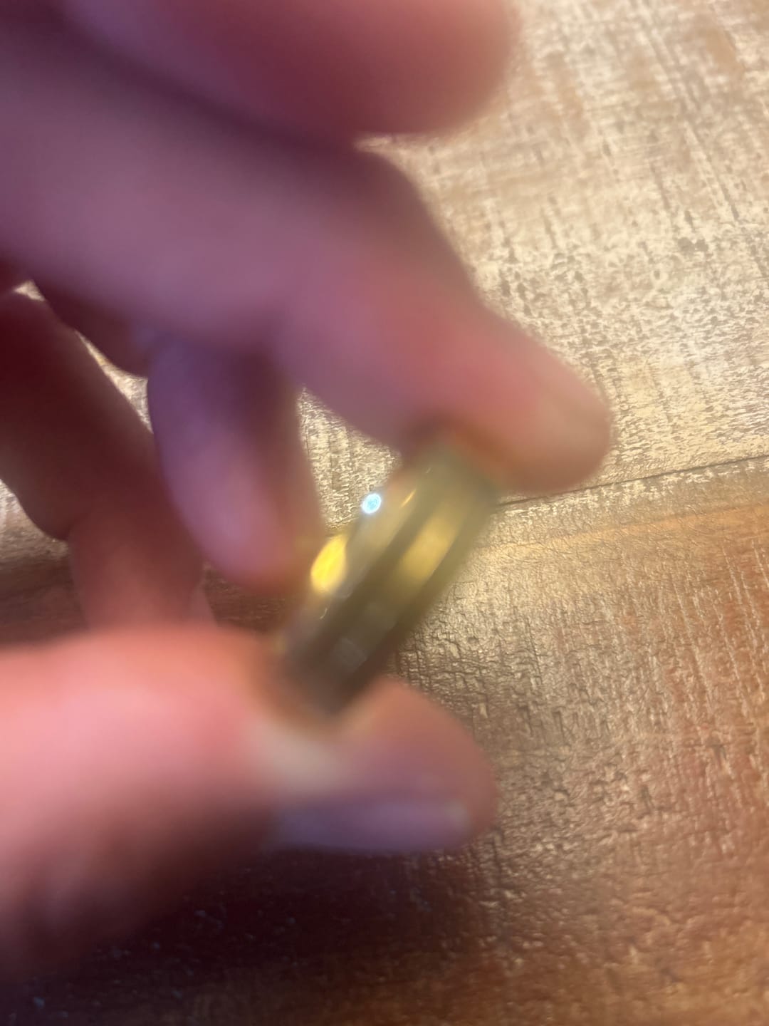 Customer photo review of Gold Titanium Wedding Band W/ 9 CZ Diamond Inlay High Polish 6mm