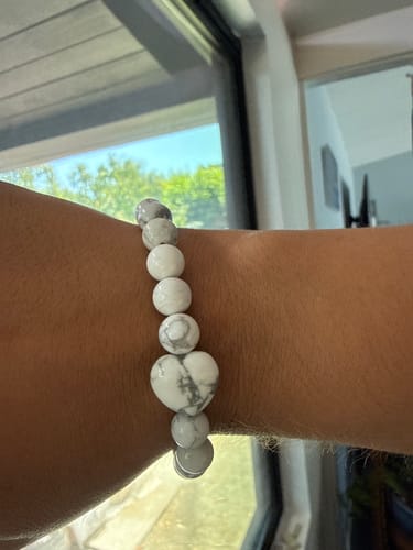 Customer's VIP Crystal Club bracelet featuring white and grey marble-pattern beads on a wrist, with a heart shape.