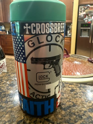 Customer's Universal Buddy Mystery covered in custom stickers, sitting on a kitchen counter.