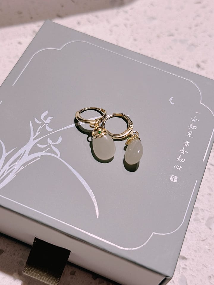 Customer photo review of Seraphine Jade Teardrop Huggie Earrings