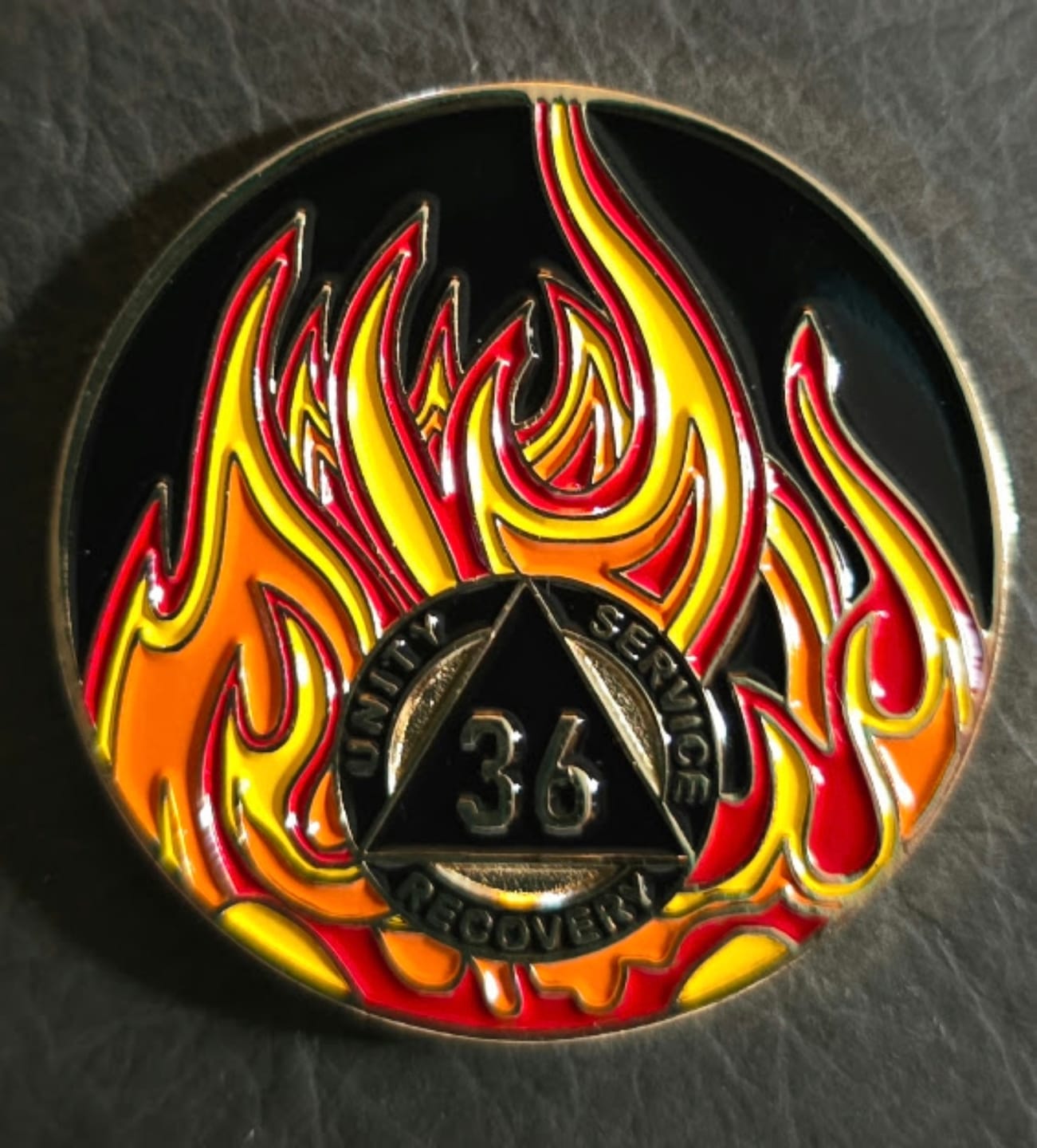 Customer photo review of 1 to 40 Year Sobriety Mint Twisted Flames Gold Plated AA Recovery Medallion/Chip/Coin - Black/Red/Orange/Yellow