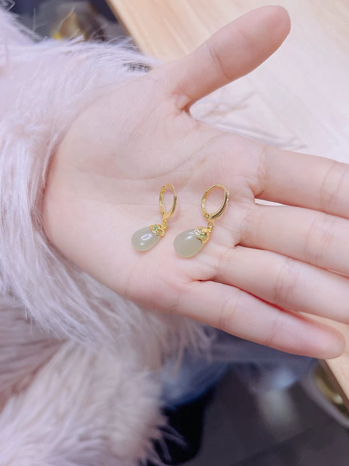 Customer photo review of Seraphine Jade Teardrop Huggie Earrings