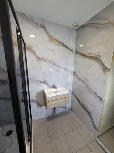 Customer photo review of Panneau Mural PVC Effet Marbre Doré – Étanche et facile à poser