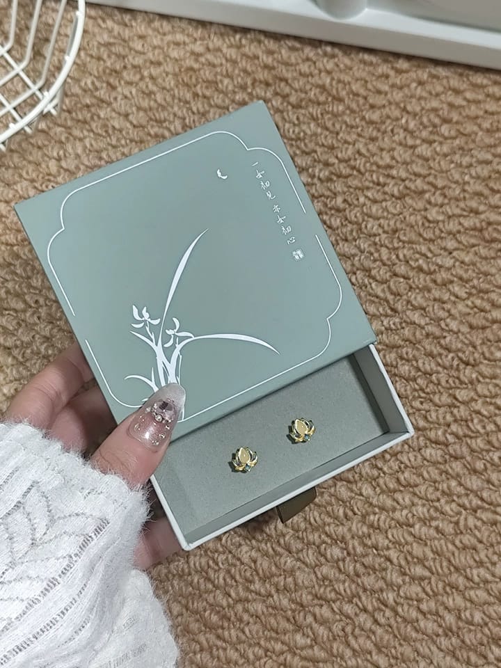 Customer photo review of Nerida Jade Lotus Stud Earrings