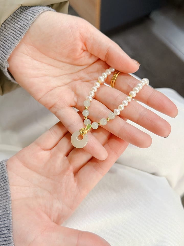 Customer photo review of Vivienne Jade Peace Buckle Pearl Necklace