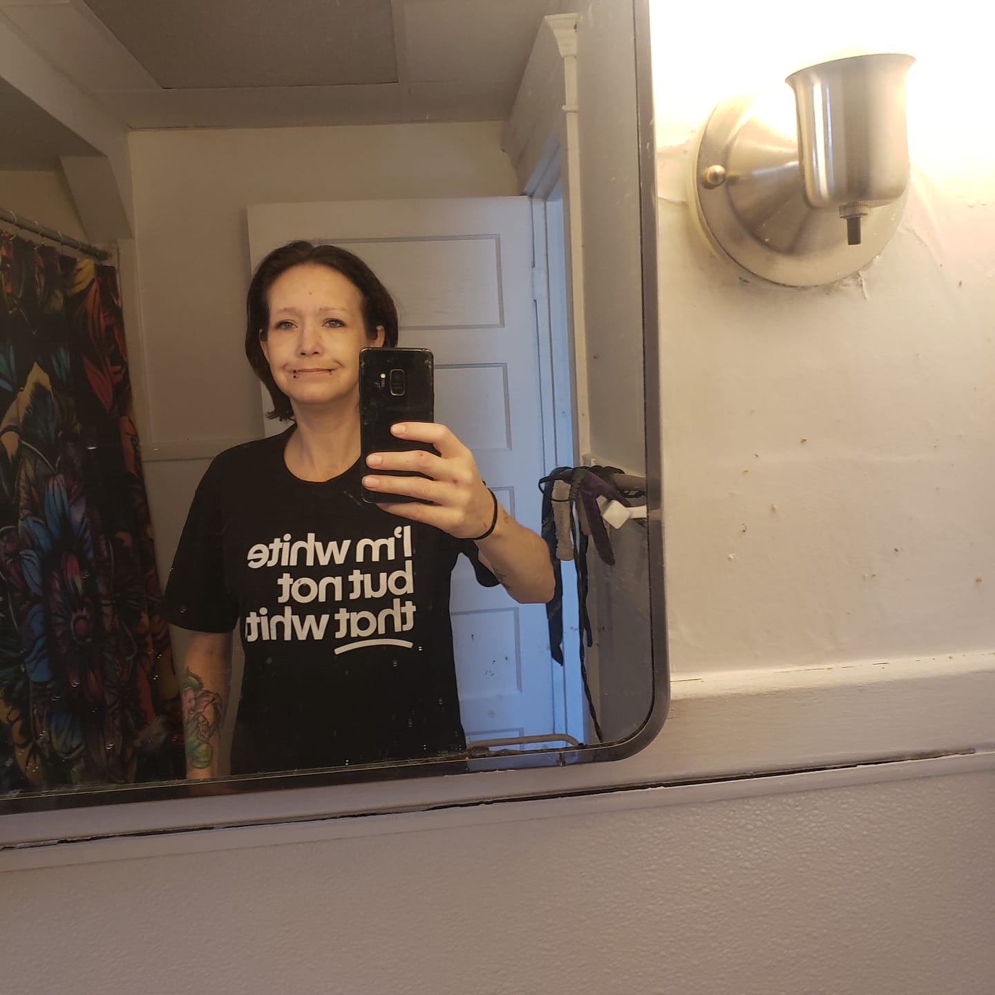 Customer photo review of I’m white but not that white Unisex Tee