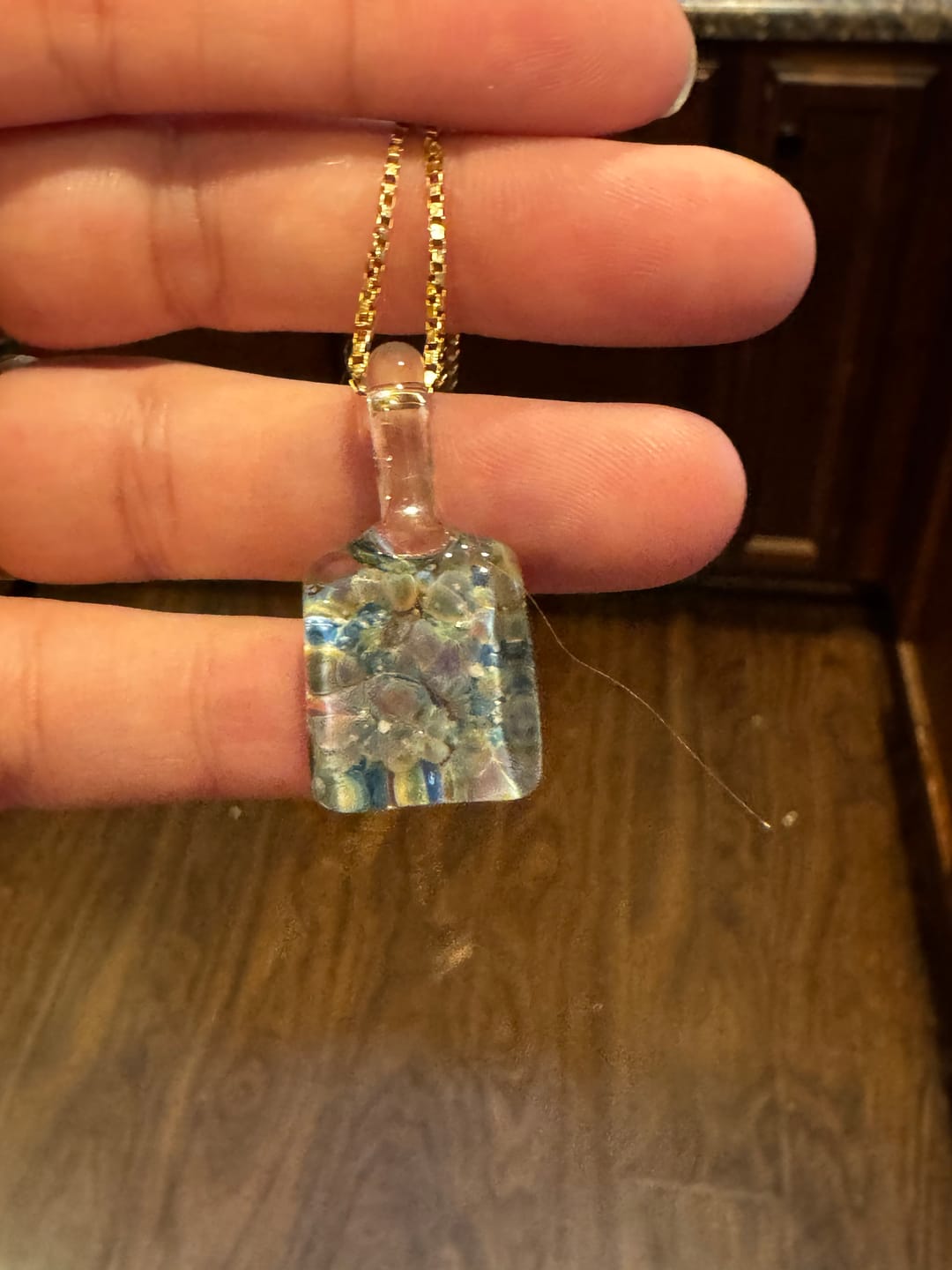 Customer photo review of Rainbow Sky Pendant with Infused Cremation Ashes
