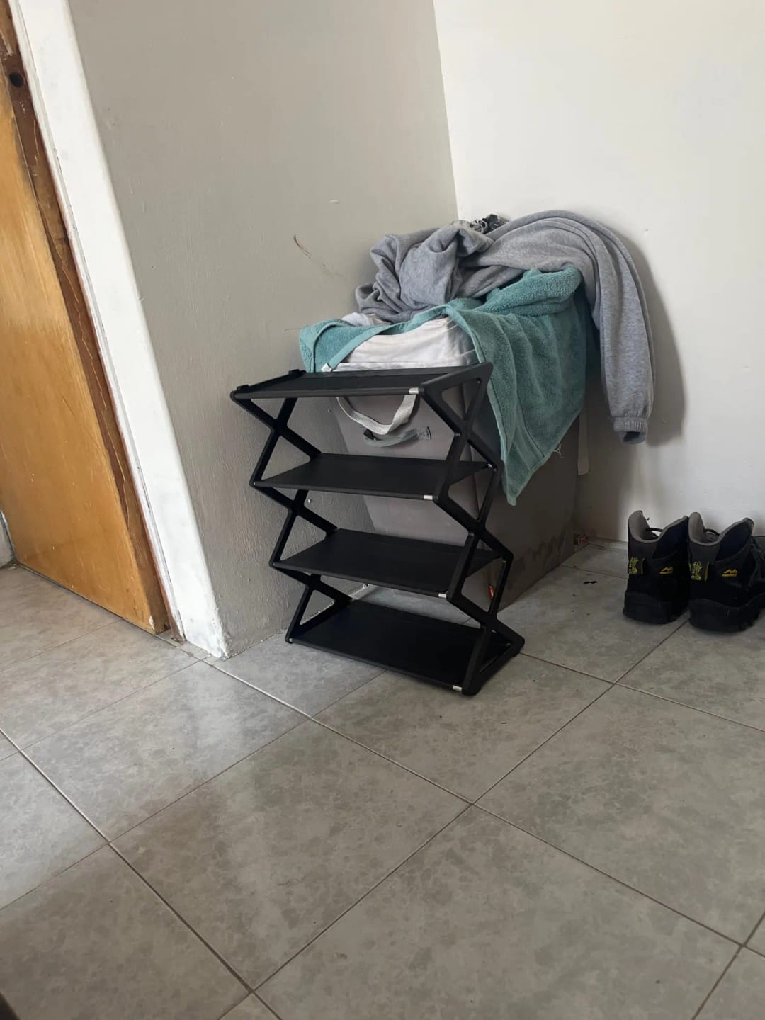 Customer photo review of Four-Tier X-Frame Shoe Rack with Dustproof Shelf Covers