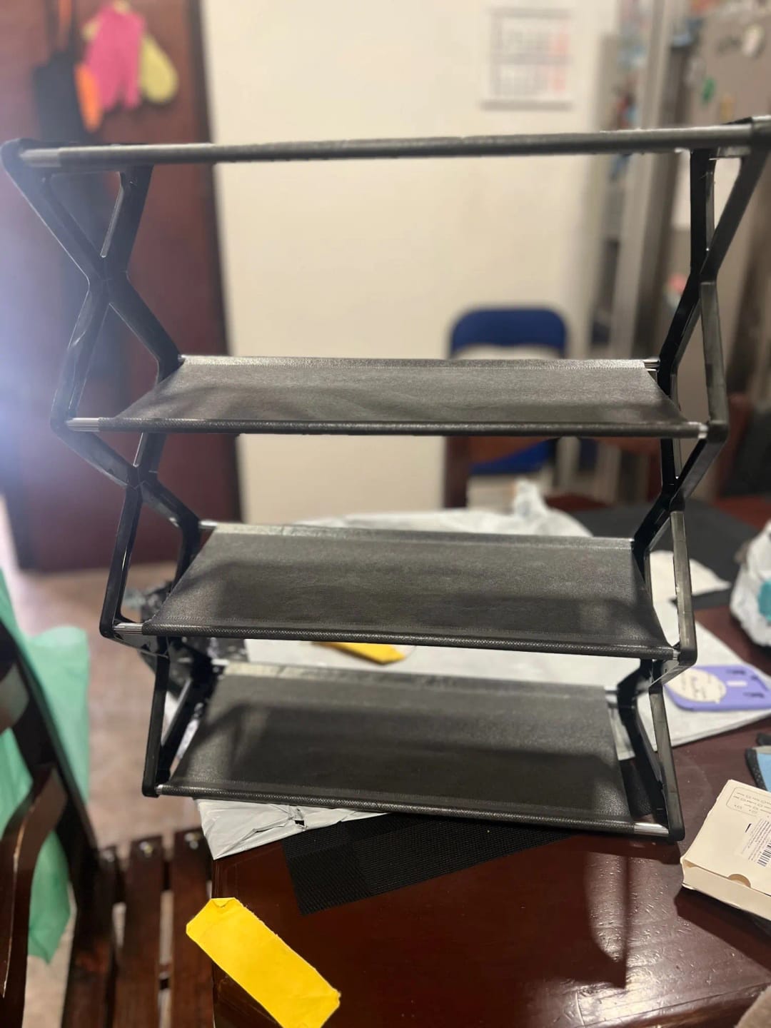 Customer photo review of Four-Tier X-Frame Shoe Rack with Dustproof Shelf Covers