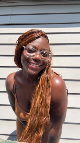 Reviewer's Miracle Knots Crochet Hair in a loose, wavy style after being dyed a copper tone.