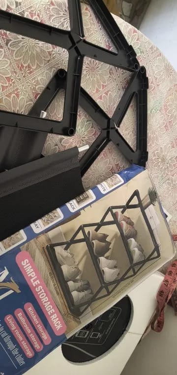 Customer photo review of Four-Tier X-Frame Shoe Rack with Dustproof Shelf Covers