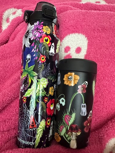 Customer's Toxic Bloom Bottle Buddy next to a matching smaller bottle on a bright pink fuzzy background.