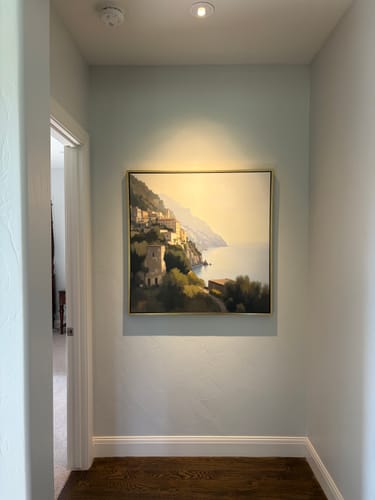 Customer's Italian Reverie canvas art hanging on a light blue hallway wall.