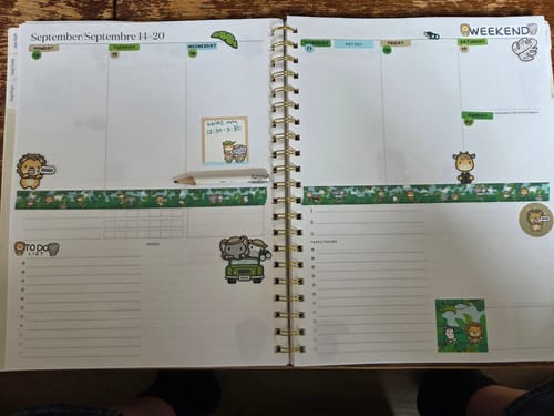 Customer's planner decorated with Ultimate Subscription stickers including animal decals and horizontal washi tape.