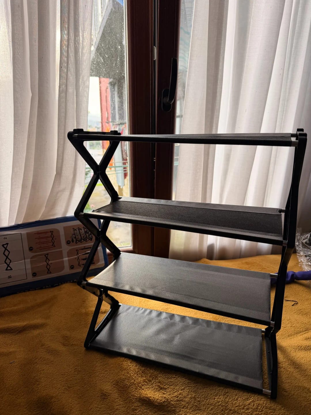Customer photo review of Four-Tier X-Frame Shoe Rack with Dustproof Shelf Covers