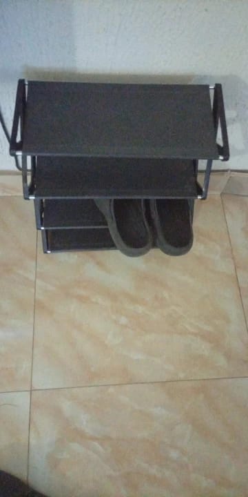 Customer photo review of Four-Tier X-Frame Shoe Rack with Dustproof Shelf Covers