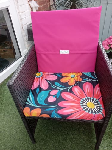 Customer's Outdoor Water Resistant Canvas Fabric used as a pink cushion cover on a garden chair.