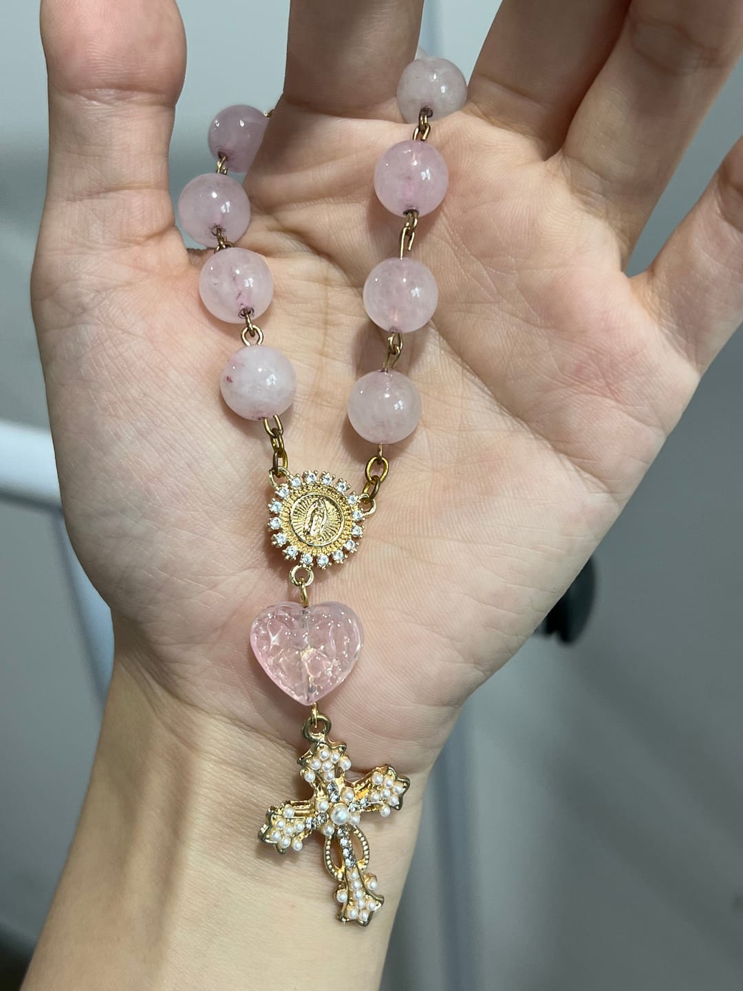 Customer photo review of SolaceBeads Artisan Rose Quartz Pocket Rosary: Soft Pink Beads with Sacred Cross & Marian Accents