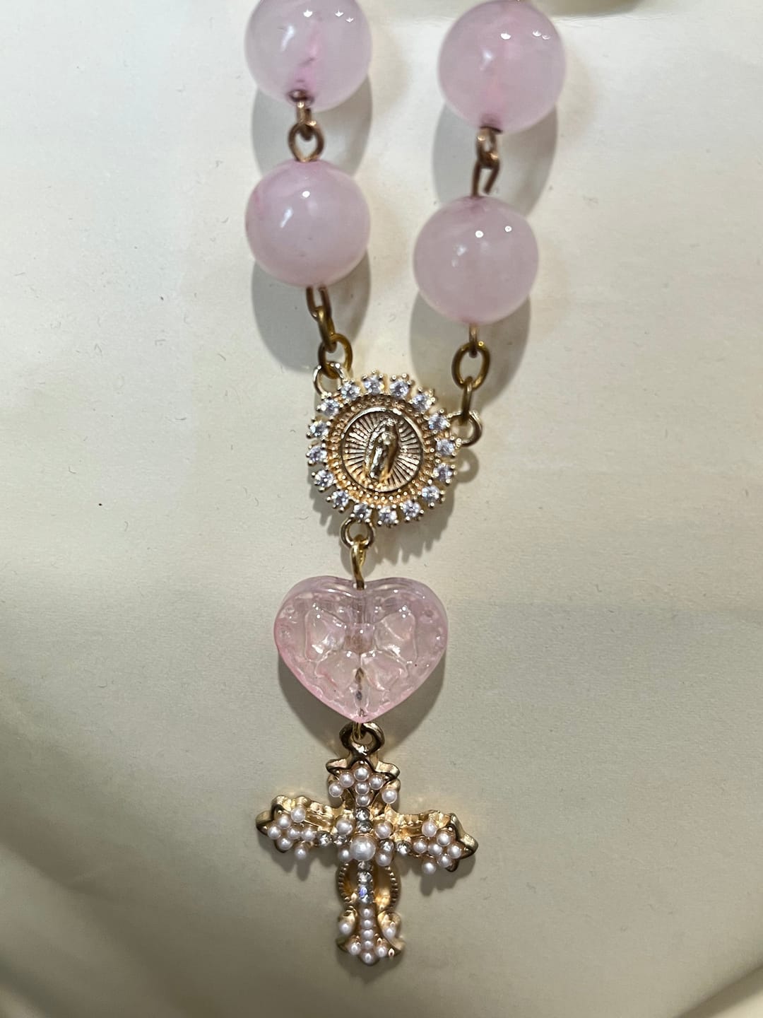 Customer photo review of SolaceBeads Artisan Rose Quartz Pocket Rosary: Soft Pink Beads with Sacred Cross & Marian Accents