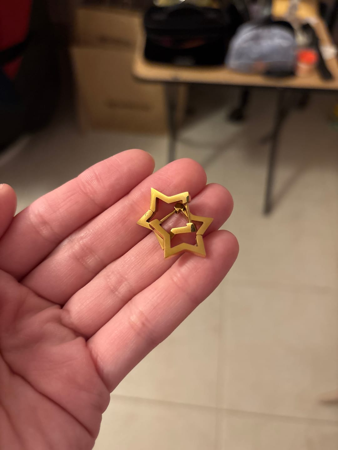 Customer photo review of Par Arracada Contorno Estrella
