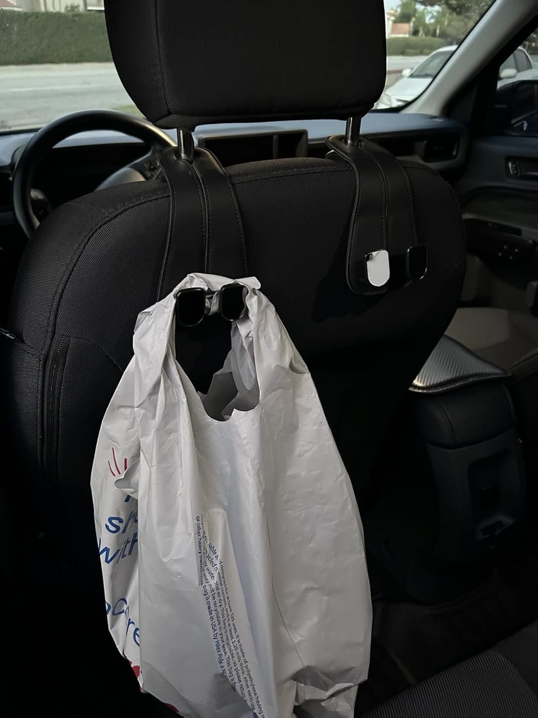 Customer photo review of BOLTHUT™ Leather Car Headrest Hooks — Back-Seat Bag Hangers