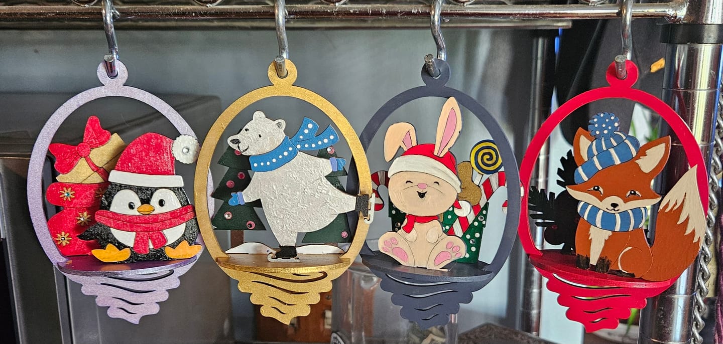 Customer photo review of 4 Laser Cut 3D Christmas Animals Ball Ornaments SVG