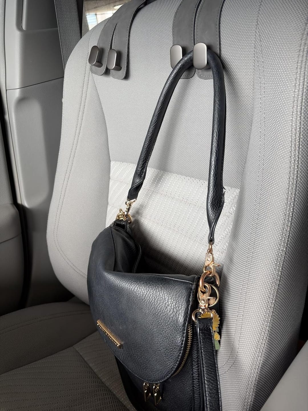 Customer photo review of BOLTHUT™ Leather Car Headrest Hooks — Back-Seat Bag Hangers