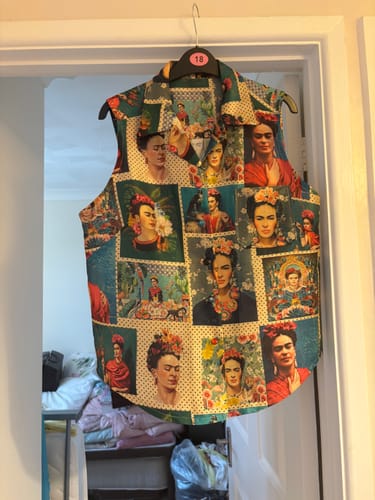 Customer's sleeveless shirt made from Colourful Muse Faux Silk Fabric featuring a vibrant Frida Kahlo print
