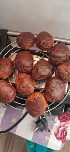 Customer's brown pastries displayed on a round wire cooling rack.
