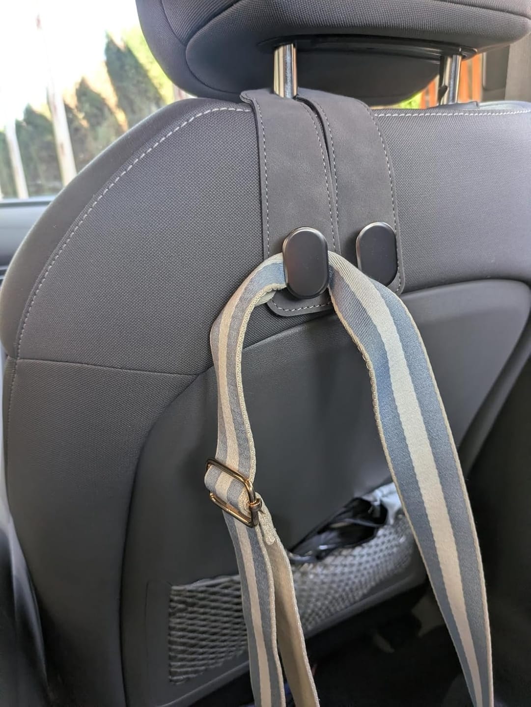 Customer photo review of BOLTHUT™ Leather Car Headrest Hooks — Back-Seat Bag Hangers