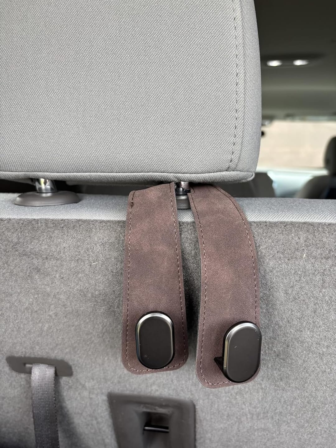Customer photo review of BOLTHUT™ Leather Car Headrest Hooks — Back-Seat Bag Hangers
