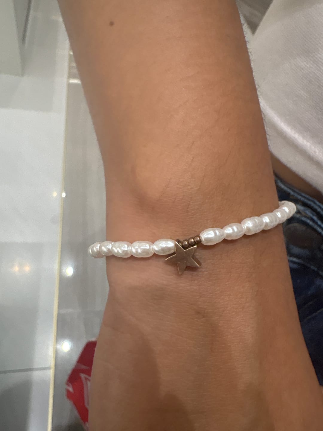 Customer photo review of Pulsera Perlitas Con Dije