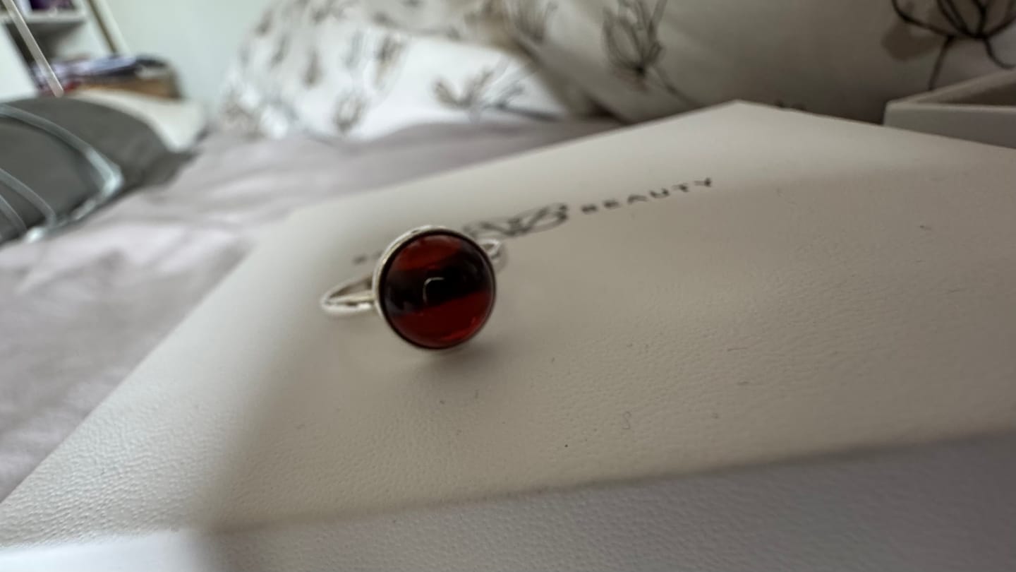 Customer photo review of ESSENTIALS Cherry Red Amber Solitaire Ring