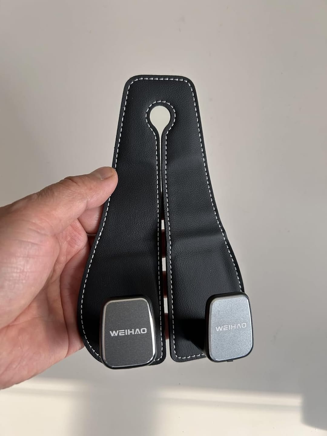 Customer photo review of BOLTHUT™ Leather Car Headrest Hooks — Back-Seat Bag Hangers