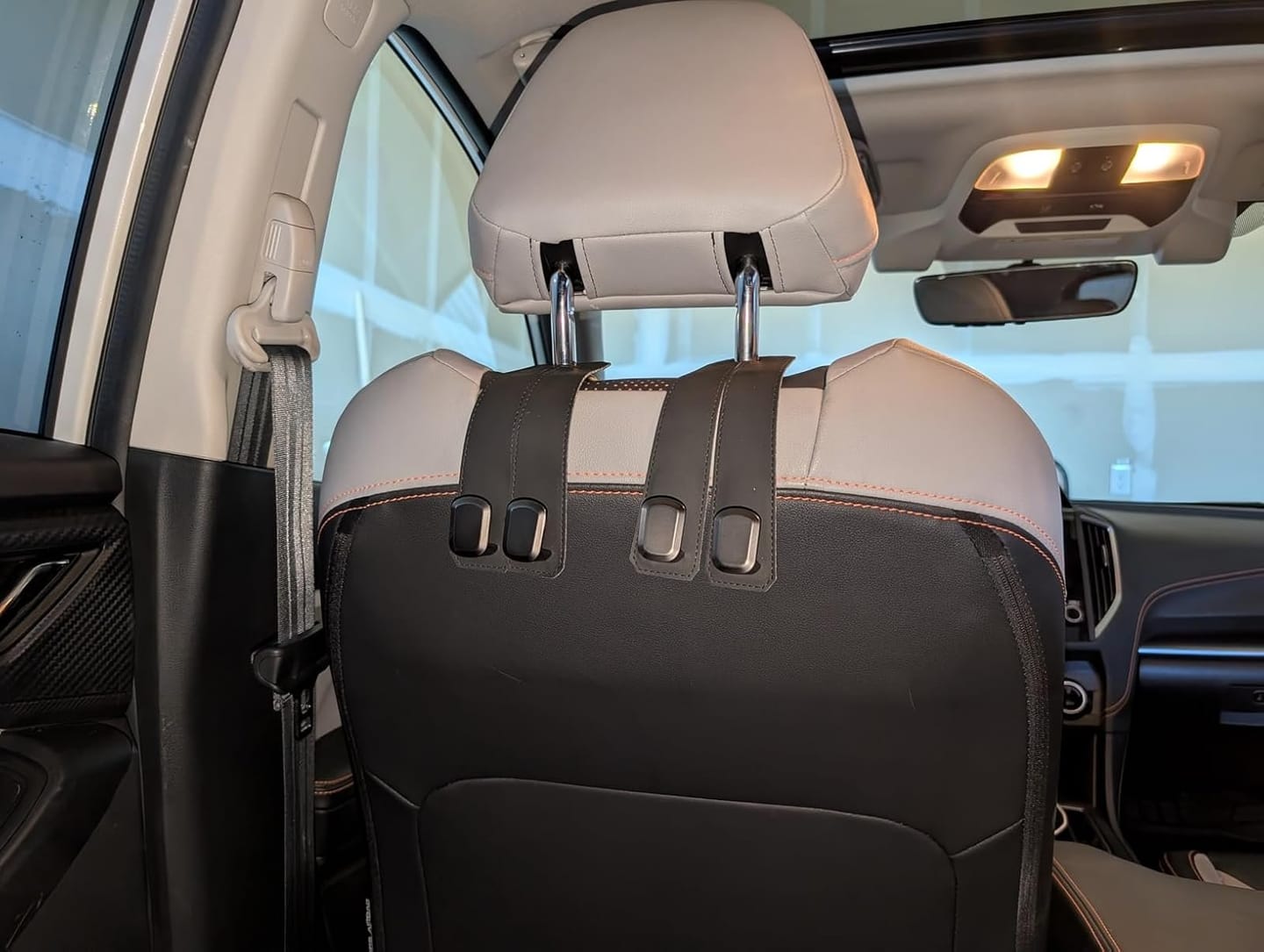 Customer photo review of BOLTHUT™ Leather Car Headrest Hooks — Back-Seat Bag Hangers