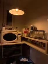 Customer photo review of 2-Tier Bamboo Countertop Shelf with Clear Acrylic Bottom for Cosmetics & Spices