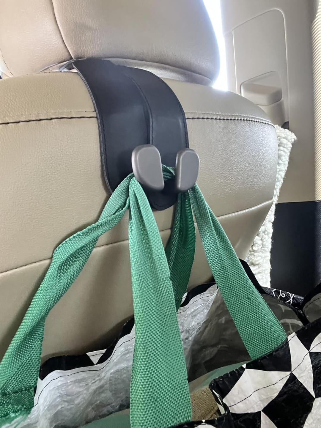 Customer photo review of BOLTHUT™ Leather Car Headrest Hooks — Back-Seat Bag Hangers