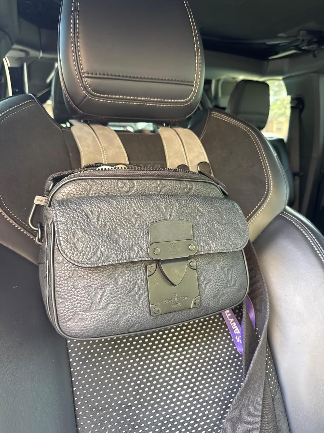 Customer photo review of BOLTHUT™ Leather Car Headrest Hooks — Back-Seat Bag Hangers