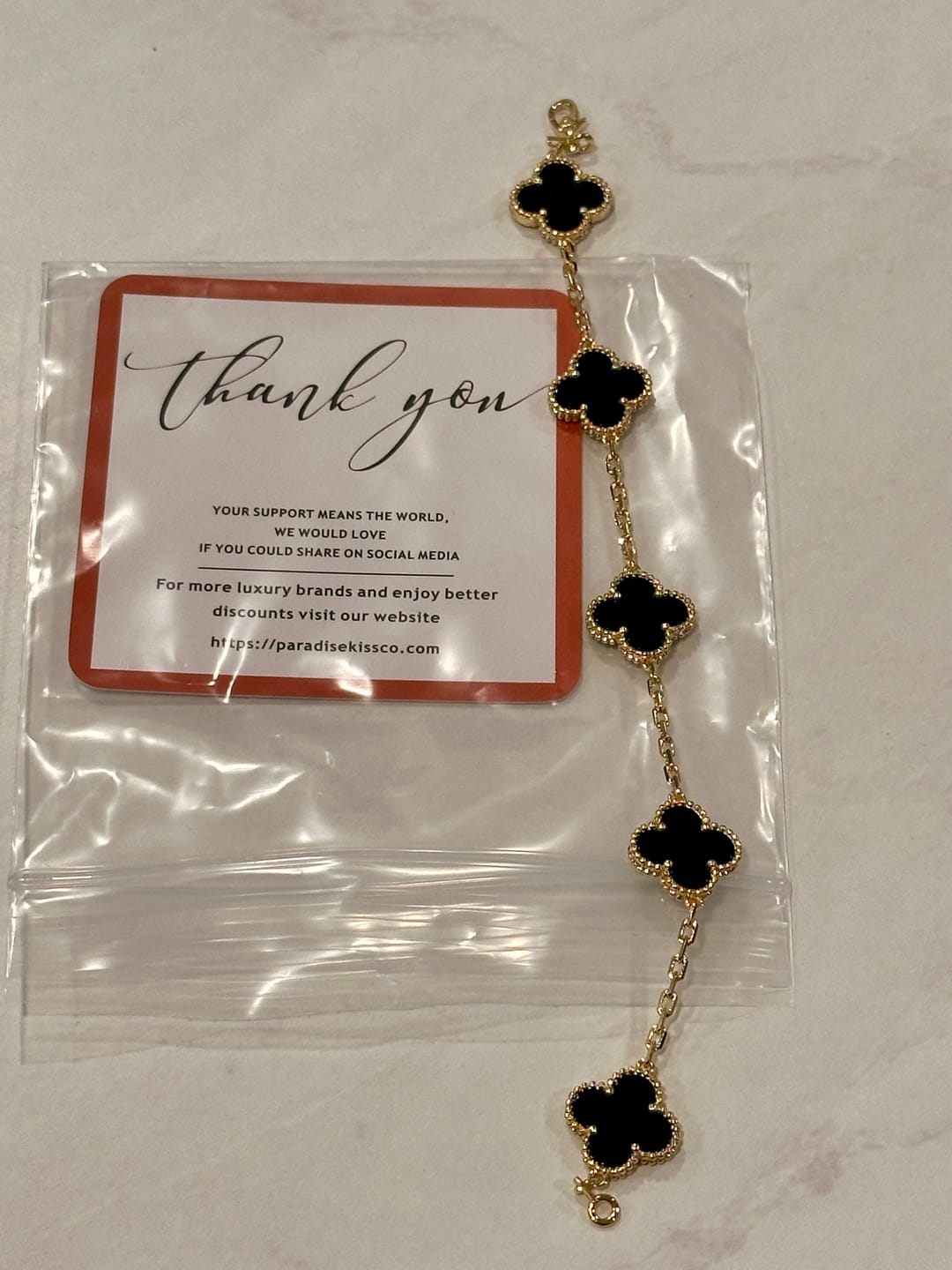 Customer photo review of 15mm Onyx 5 motifs clover bracelet with 18k gold plated 7.5 inches