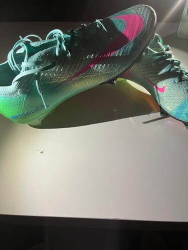 Customer's Mercurial Vapor 16 Elite FG Cosmic Speed Vert football boots in bright green and pink