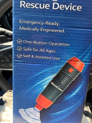 Customer's Rescue Device packaging, featuring a red and black handheld unit with a clear suction mask.