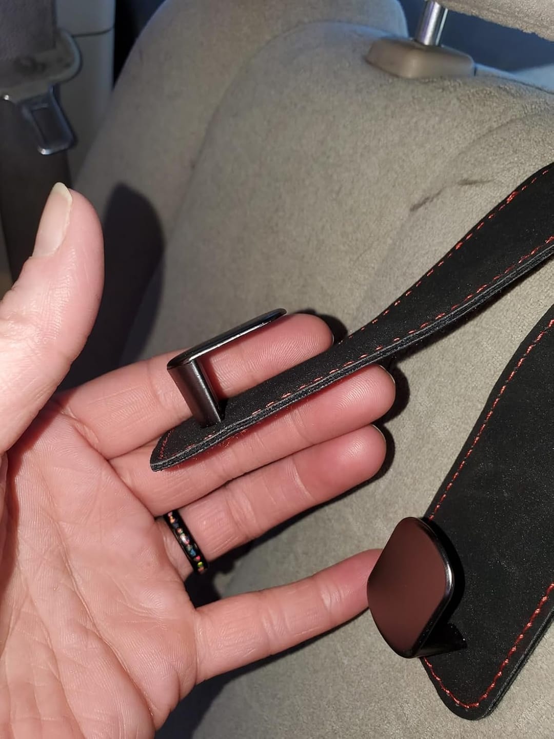Customer photo review of BOLTHUT™ Leather Car Headrest Hooks — Back-Seat Bag Hangers