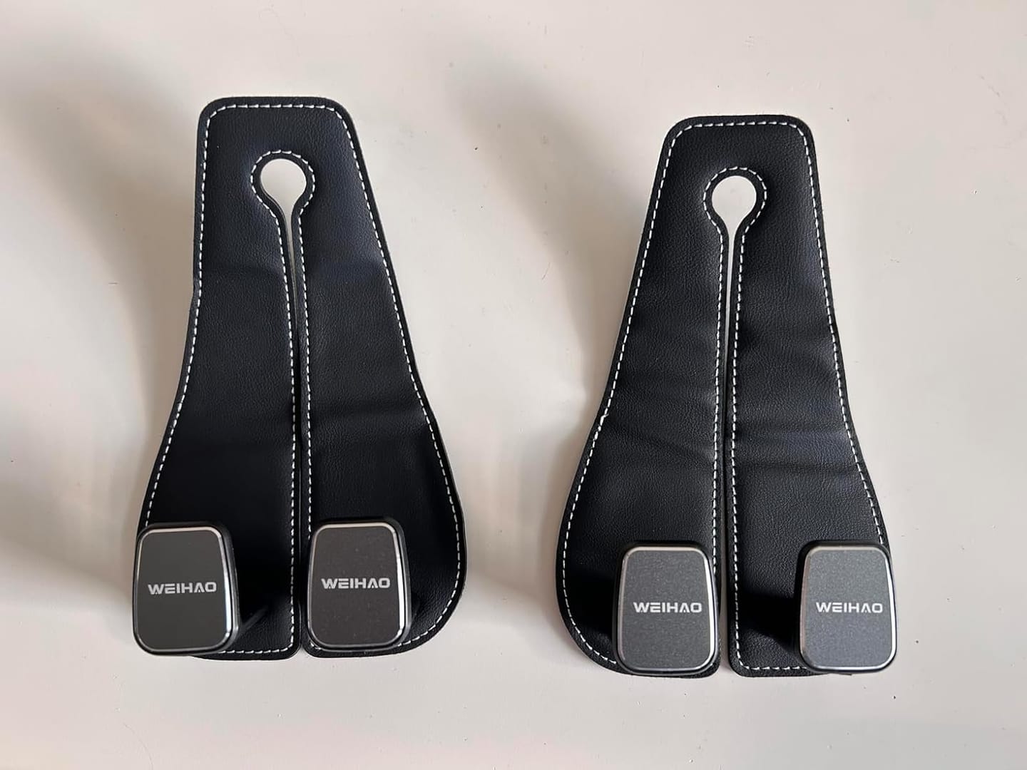 Customer photo review of BOLTHUT™ Leather Car Headrest Hooks — Back-Seat Bag Hangers