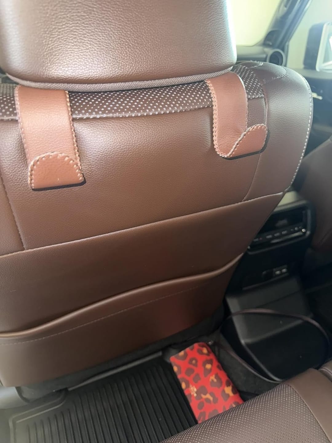 Customer photo review of BOLTHUT™ Leather Car Headrest Hooks — Back-Seat Bag Hangers