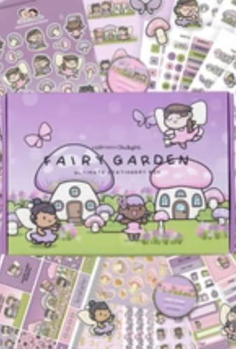 Customer's Fairy Garden themed Ultimate Subscription box surrounded by colorful sticker sheets and stationery.