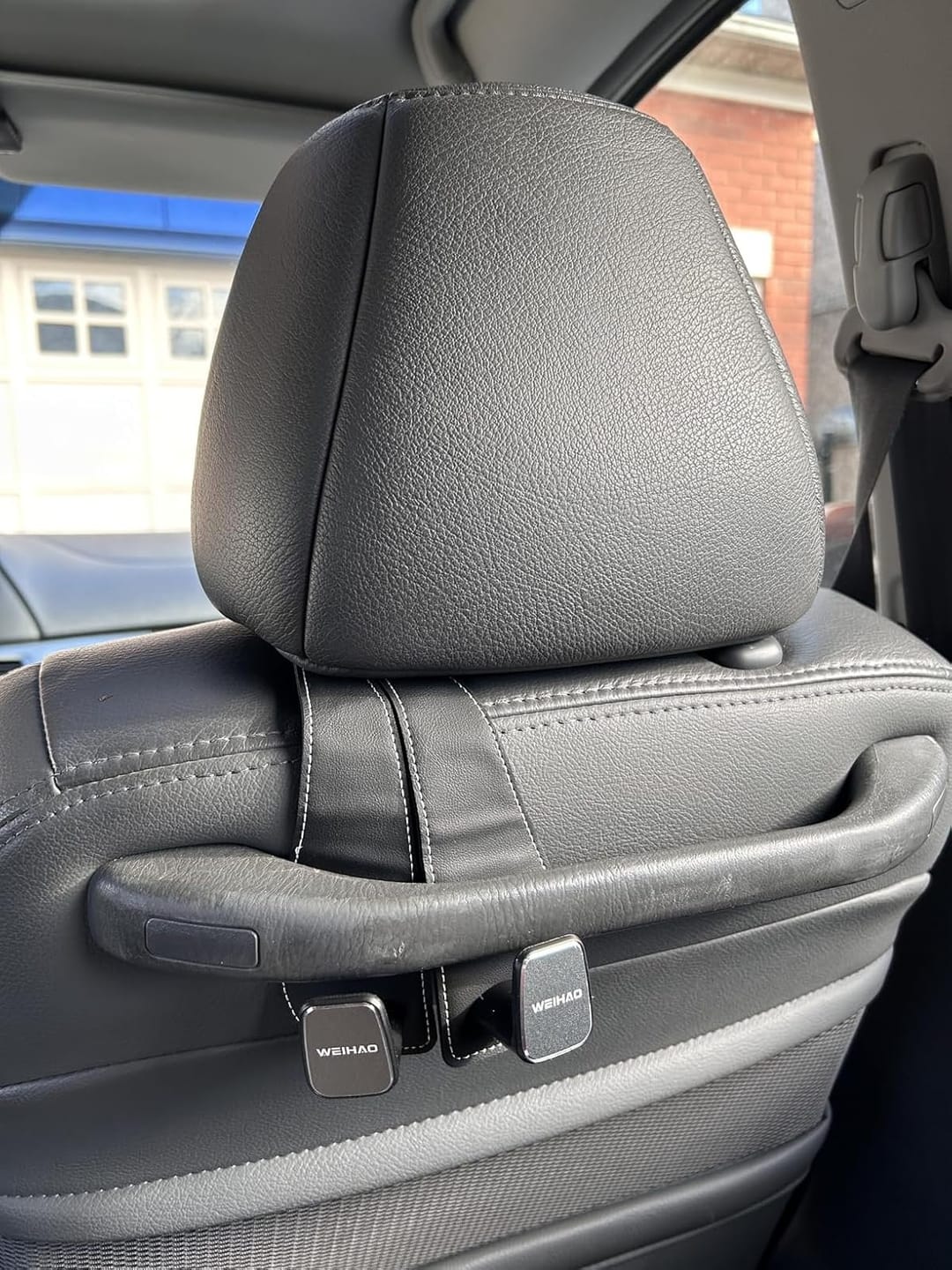 Customer photo review of BOLTHUT™ Leather Car Headrest Hooks — Back-Seat Bag Hangers