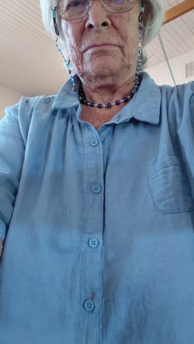 Reviewer wearing a light blue, cotton turn-down collar shirt.