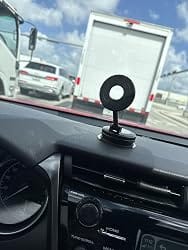 Customer photo review of Foldable Vacuum Suction Cup Phone Holder – Double-Sided Magnetic Desk Stand for iPhone & Android